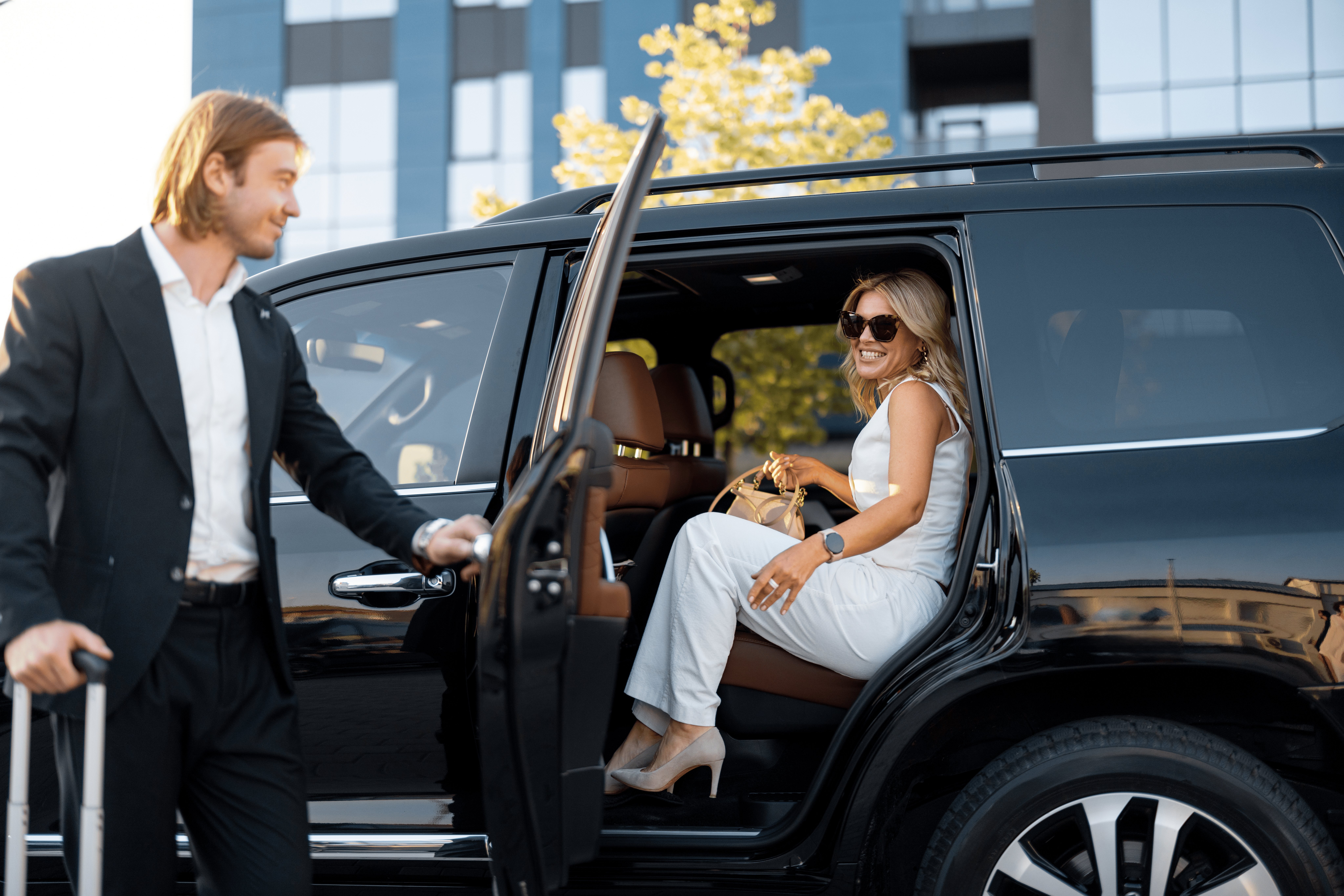 Private hire car waiting at JFK Terminal 4 arrivals hall for a named passenger